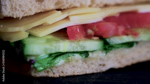Flatbread sandwich with cheese tomato cucumber salad and sauce