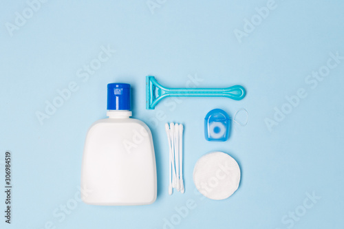 Woman Bath cleaning care morning routine top view flat lay composition with white and blue items on light blue desk photo