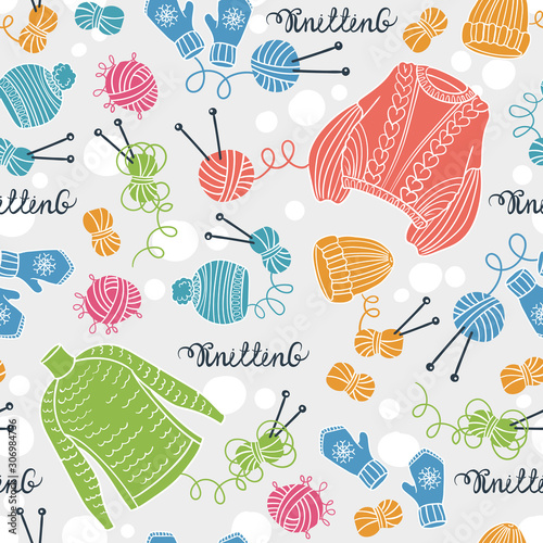 Vector seamless pattern with colored sweaters, hats, mittens, balls of yarn and knitting needles. Background on the theme of hobby and knitting
