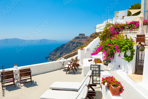 White architecture on Santorini island, Greece. Beautiful terrace with sea view. Summer holidays, travel destinations concept