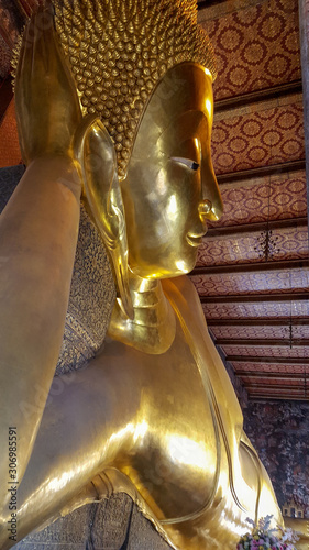 Reclining buddha golden statue In Wat Phra Chetuphon - Thailand Landmark