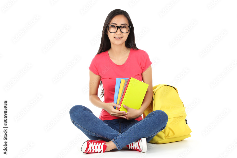 Young woman with books and backpack on white background Young woman with books and backpack on white background