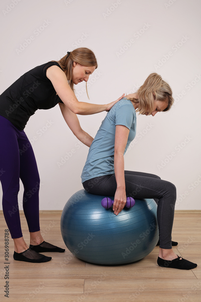 Female Personal Trainer, Pilates class. Corrective gymnastics