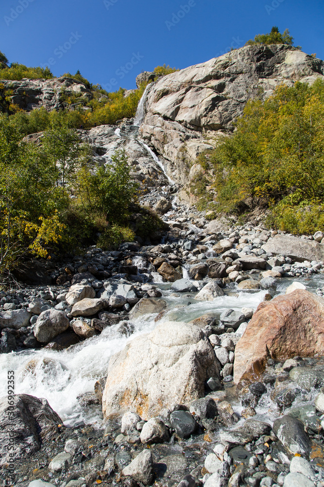 Dombay mountains, trekking in national park to the Alibek waterfall and glacier, autumn landscape Dombay mountains, trekking in national park to the Alibek waterfall and glacier, autumn landscape