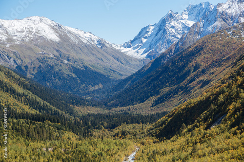 Dombay mountains, trekking in national park to the Alibek waterfall and glacier, autumn landscape