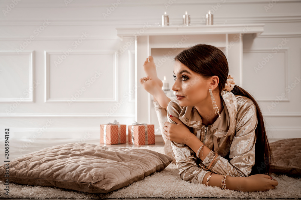 Slim young woman in home interior and chrsitmas time. Slim young woman in home interior and chrsitmas time.