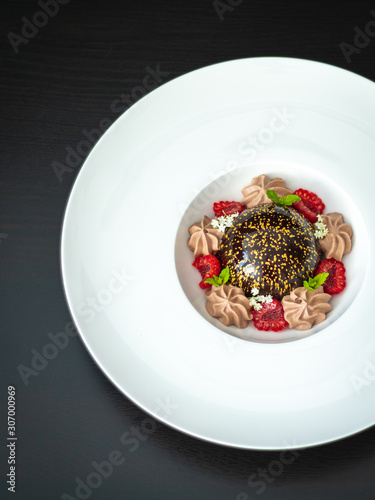 Mini mousse pastry dessert with chocolate glazed. Modern european cake. French cuisine. © RAW Digital Studio