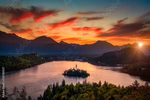 Colorful landscape sunrise at Lake Bled with dramatic sky  Slovenia