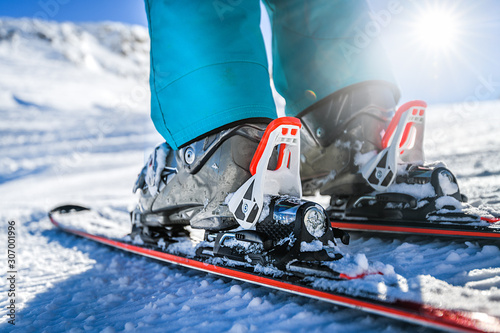 Winter skis and detailed view of the ski bindings concept in sunny day. photo