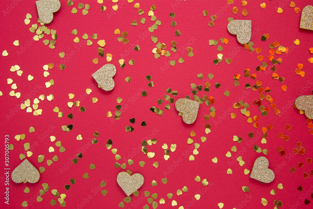 Love abstract red background with golden heart shaped glitter. Party or Valentine's Day flat lay. Party greeting card. Love abstract red background with golden heart shaped glitter. Party or Valentine's Day flat lay. Party greeting card.