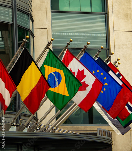 Various flags flying outside hotel