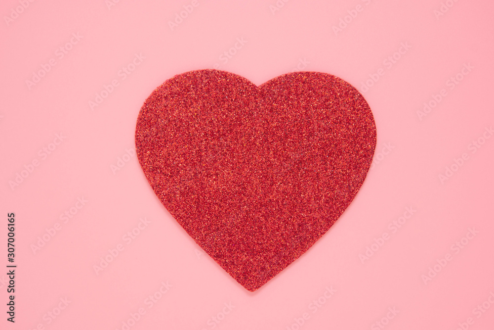 Red heart on abstract pink backgroun, love, Valentines day. Flat lay with copy space. Sparkling red heart.