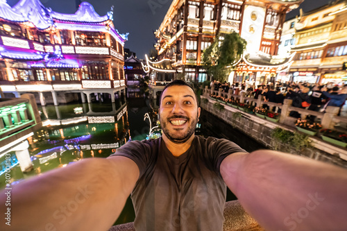 Photography Happy tourist man take selfie with Shanghai skyline, handsome similing man trave
