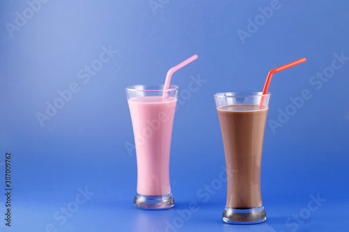 Strawberry and chocolate milkshake, sweet drink made with cow's milk.
