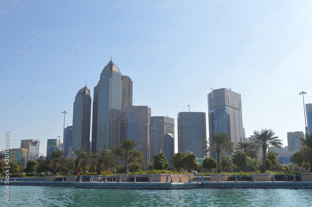 Abu Dhabi city skyline along Corniche beach taken from a boat