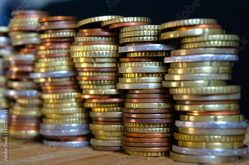 Euro coins are lined up with Euro bank notes.