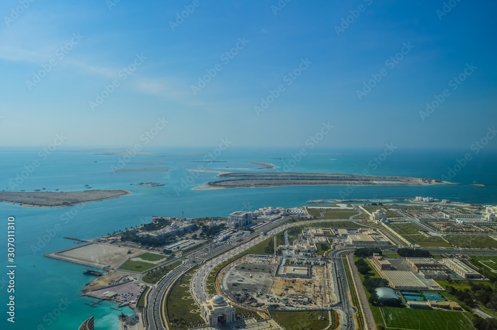 Bird's eye and aerial drone view of Abu Dhabi city from observation deck