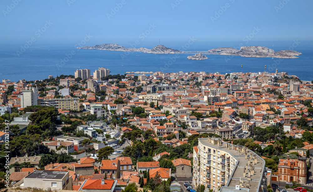 Marseille, France. Aerial panoramic view of the city, the bay and islands from the top of the hill in a summer sunny day. Holidays in France.