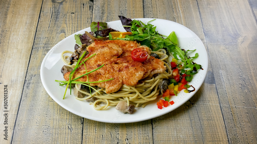 Chicken dish on a restaurant table Chicken dish on a restaurant table