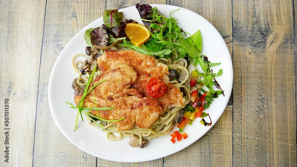 Chicken dish on a restaurant table Chicken dish on a restaurant table