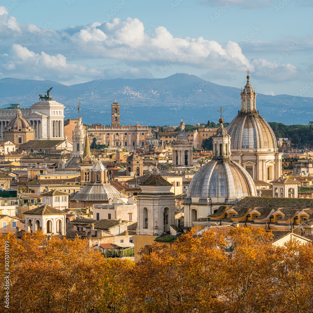 Rome skyline during autumn season, as seen from Castel Sant'Angelo, with the dome of Saint Agnes Church and the Campidoglio in background.