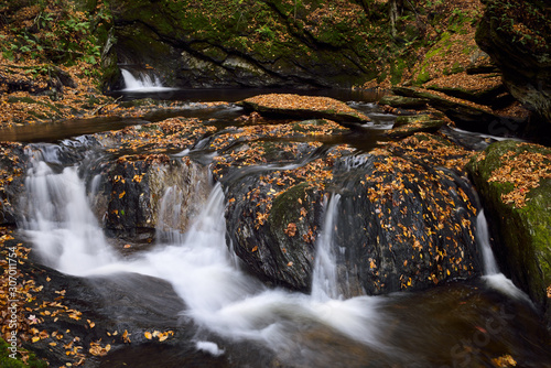 Seventh and eighth waterfall drop at Sterling Falls Gorge in Fall near Stowe Vermont