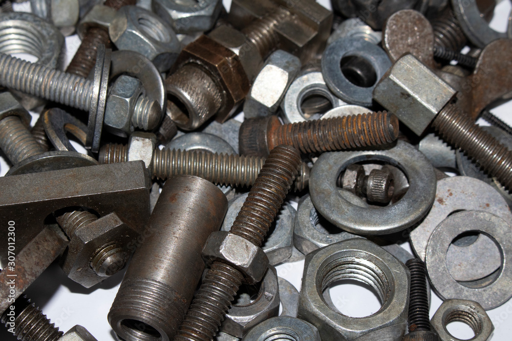 Collection of Old Bolt, Screws, Nuts Engineering Metal Tools on White Background Collection of Old Bolt, Screws, Nuts Engineering Metal Tools on White Background
