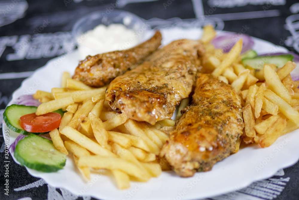 Chicken dish on a restaurant table Chicken dish on a restaurant table