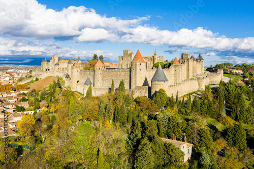 Aerial view of Cite de Carcassonne, a medieval hilltop citadel in the French city of Carcassonne, Aude, Occitanie, France. Founded in the Gallo-Roman period, the town is fortified by two castle walls
