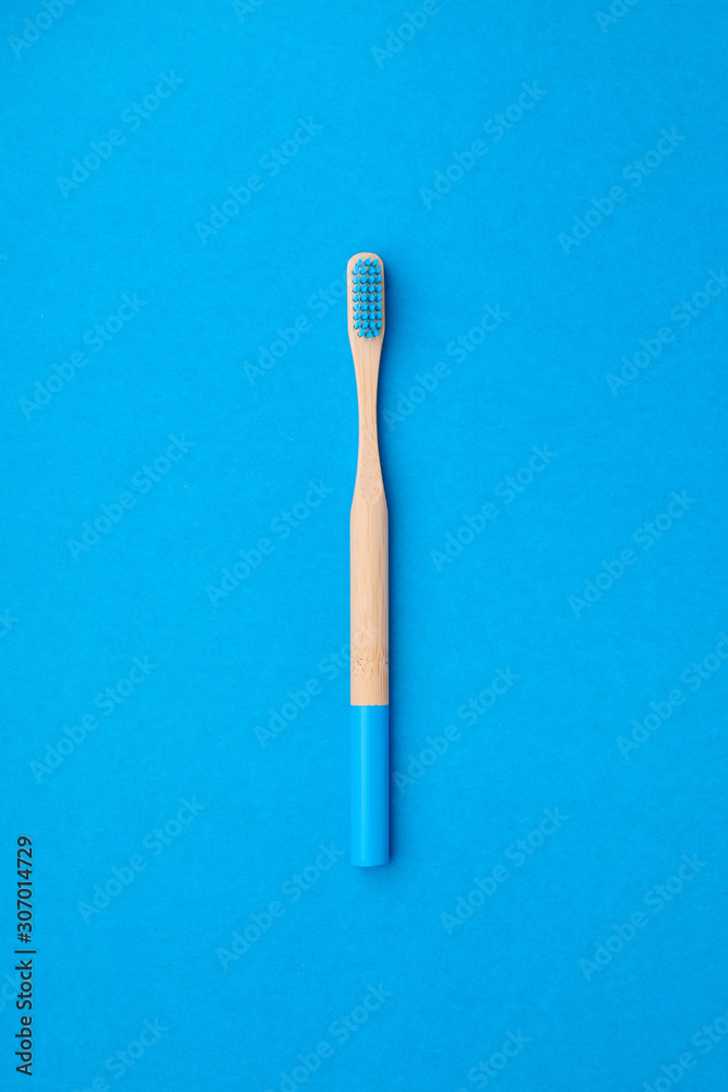 Toothbrush on blue background top view copy space. Tooth care, dental hygiene and health concept. Toothbrush on blue background top view copy space. Tooth care, dental hygiene and health concept.