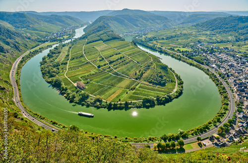 Moselle River bend near Bremm town, Germany. Hills with vineyards, river loop and road along the river. Meander of the Moselle.