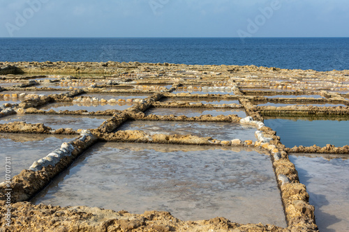 Salt panes in Malta carved in soft sandstone