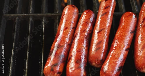 Video Slide While Removing Hot Dogs From Grill