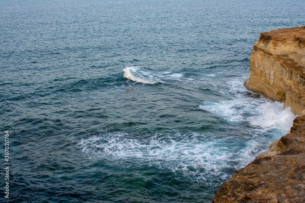 Rocky seaside in windy waves in the mediterranean sea Rocky seaside in windy waves in the mediterranean sea