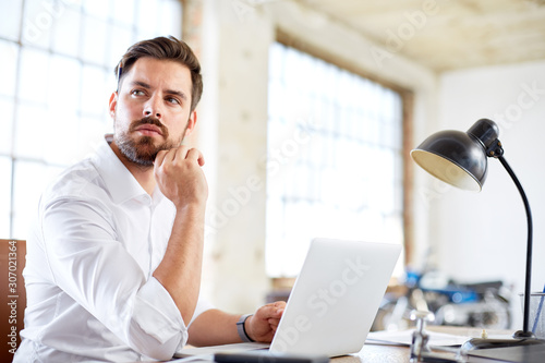 Young businessman thinking about work