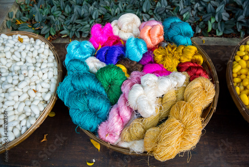 Canvas Print colorful Thai silk threads in a basket, Bangkok, Thailand