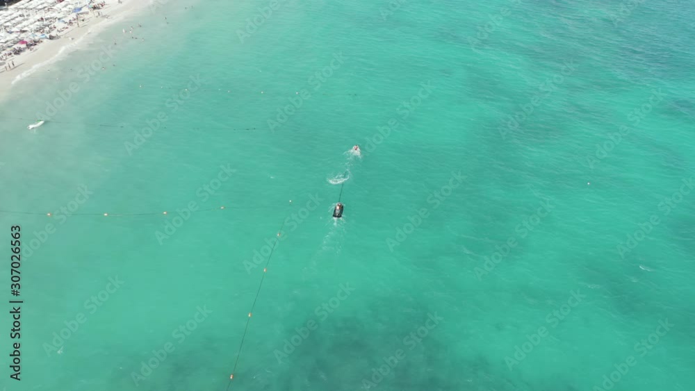 Tracking a Boat in the Aqua Blue Water Off the Coast of Cancun - 4k Aerial Shot Tracking a Boat in the Aqua Blue Water Off the Coast of Cancun - 4k Aerial Shot
