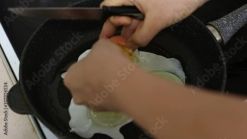 Fried egg in a pan in oil. Footage