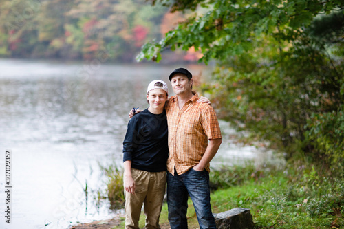 white Caucasian family father and teenager son in Fall forest