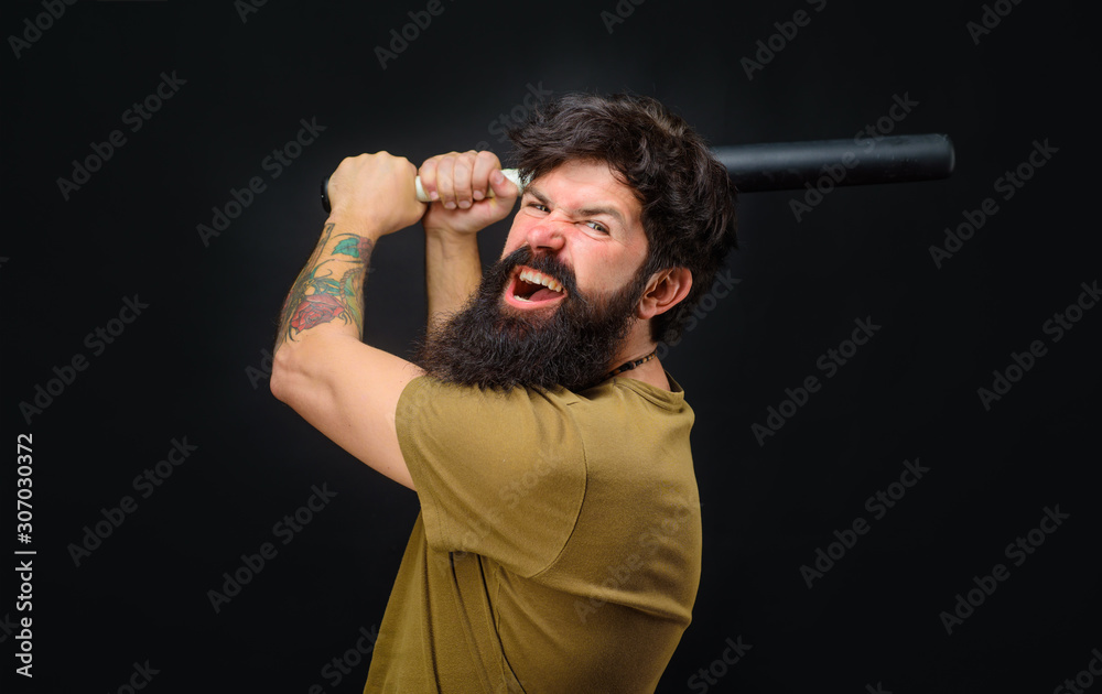 Baseball player with baseball bat. Angry man in t-shirt ready to swing. Sports and baseball training. Sport equipment. Sport, training, health. Power and energy concept. Bearded man with baseball bat.