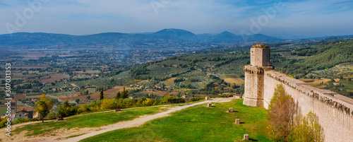 Panoramic view of Umbria countryside with St Francis Basilica from Assisi ancient walls
