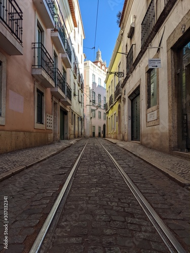 narrow street in old town of lisbon portugal Europe