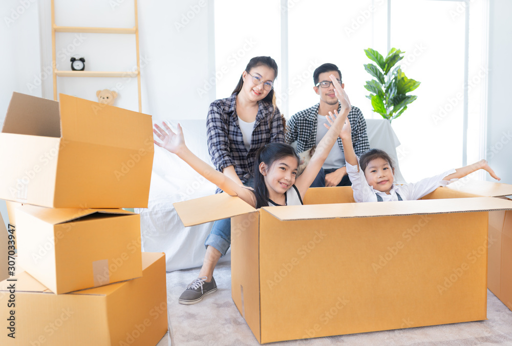 asian family packing and unpacking paper box together, they will decorating and cleaning home, they feeling happy in family time, they move to a new residence asian family packing and unpacking paper box together, they will decorating and cleaning home, they feeling happy in family time, they move to a new residence
