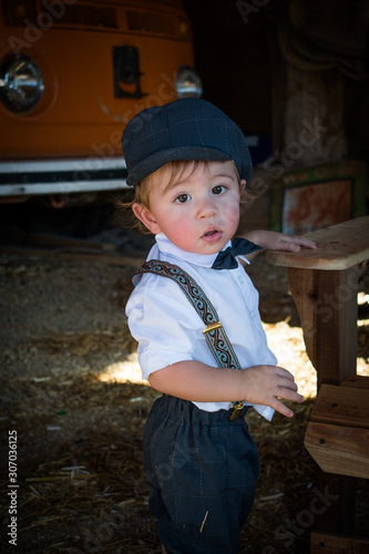Vintage boy in cap and bow tie