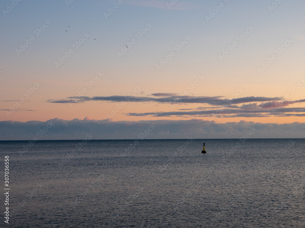Open sea with a lonely buoy.