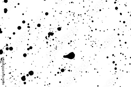 Grainy grunge abstract texture on a white background. Paint spray, drop. Black ink blow explosion on white background. Splatter of calligraphy ink in black on white background. Vector.