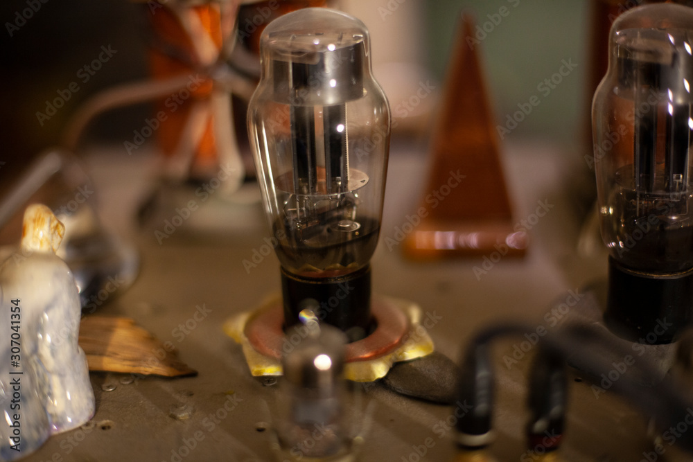 Old lamp inside the amplifier. Vintage sound technique.