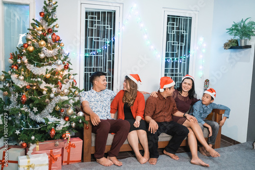 happy family gathering during christmas eve at home © Odua Images