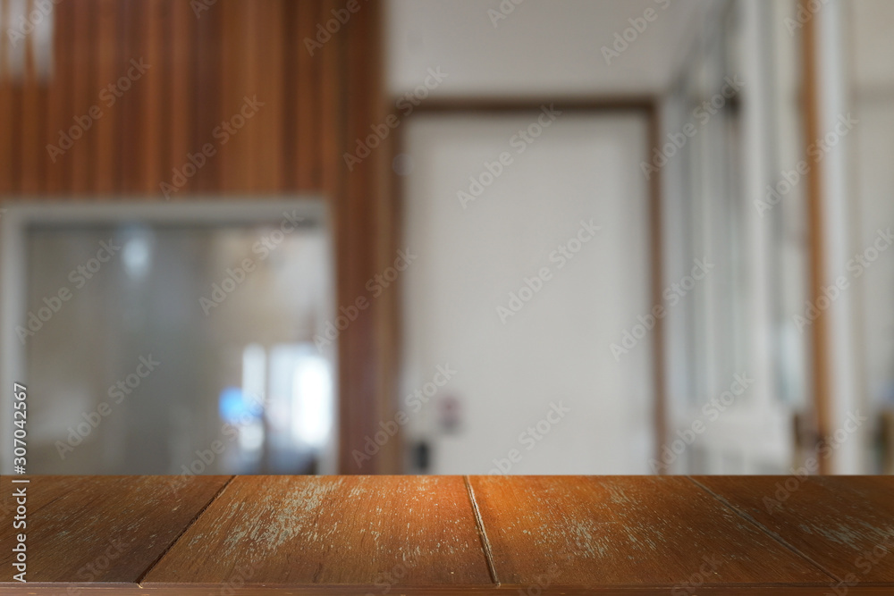 Empty dark wooden table in front of abstract blurred bokeh background of restaurant . can be used for display or montage your products.Mock up for space. Empty dark wooden table in front of abstract blurred bokeh background of restaurant . can be used for display or montage your products.Mock up for space.