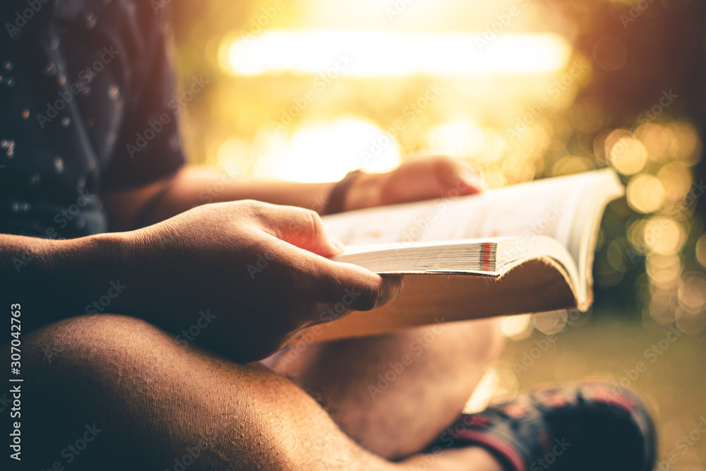 Men read book in quiet nature, Concept read a book. Men read book in quiet nature, Concept read a book.